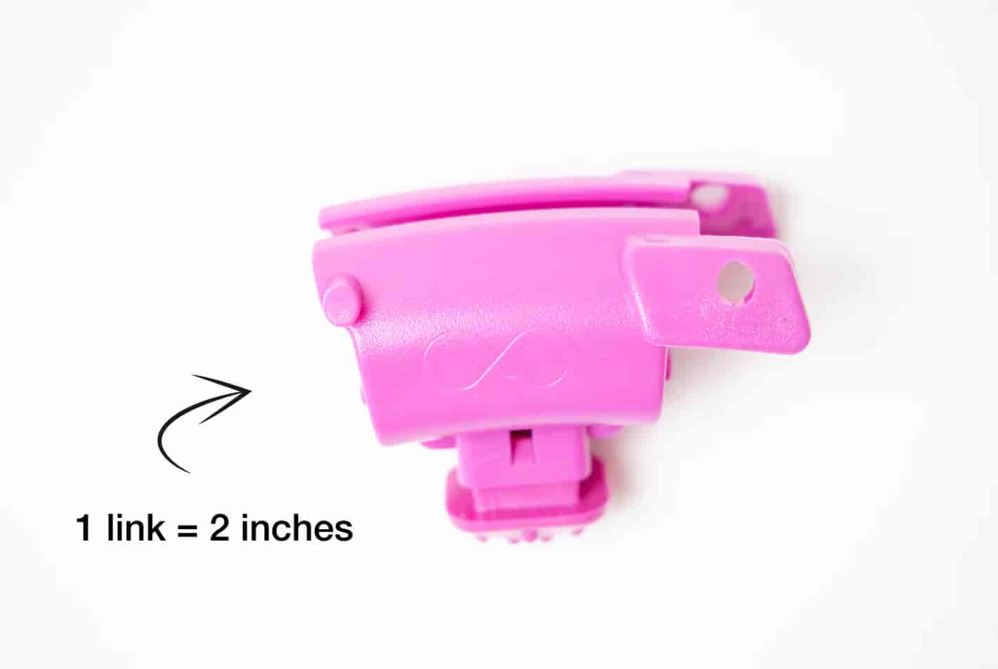 Close-up of a pink fitness hoop link with a measurement of 2 inches.